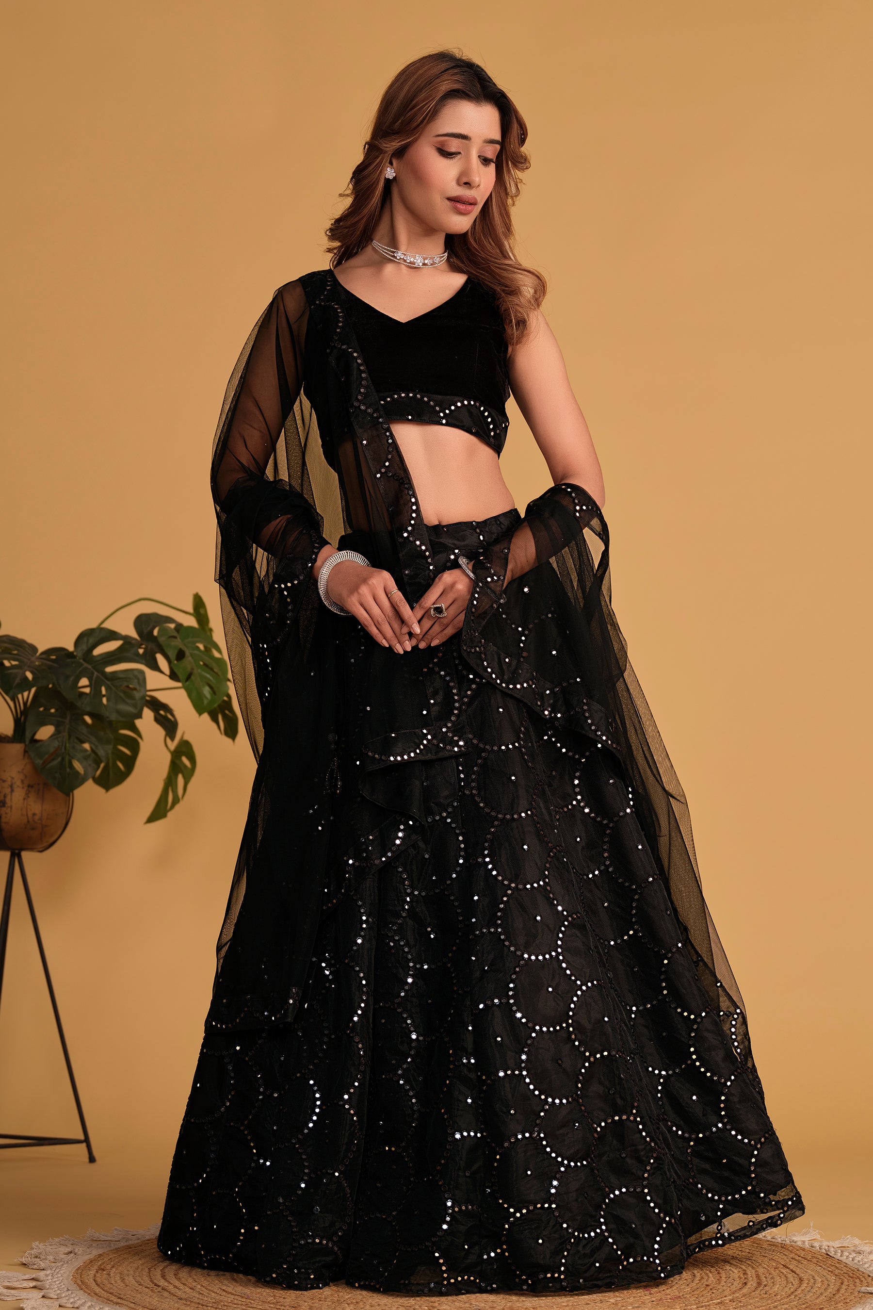 Black georgette and organza net lehenga with elegant sequin and thread embroidery
