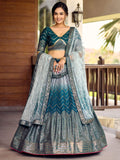 Woman wearing a blue Chinon lehenga choli with sequins and thread embroidery