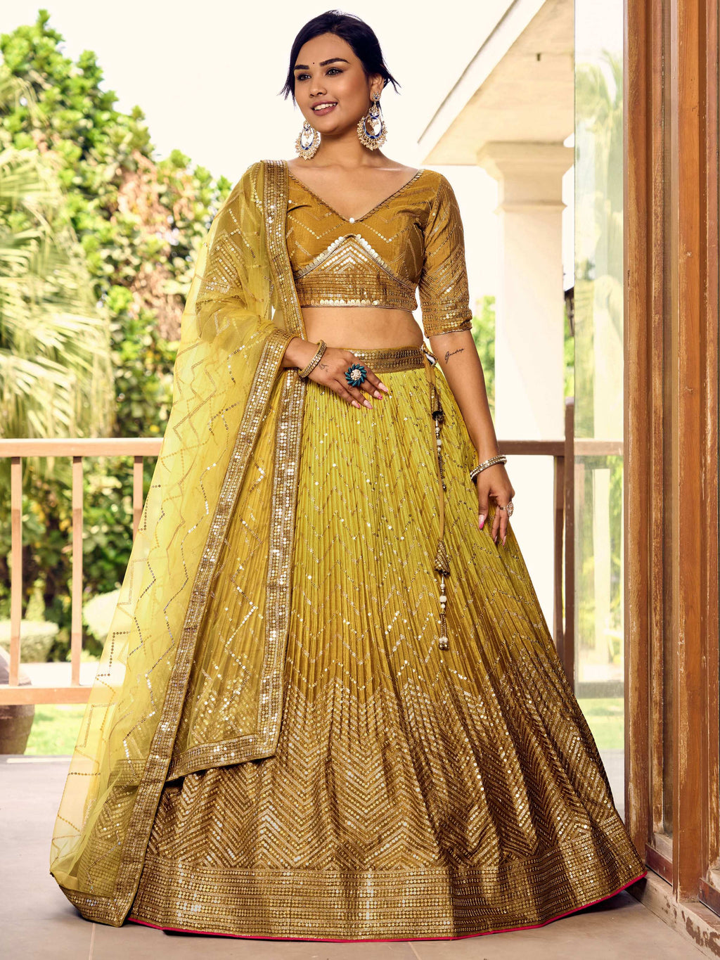 Bright yellow chinon lehenga choli set with delicate sequins and thread embroidery