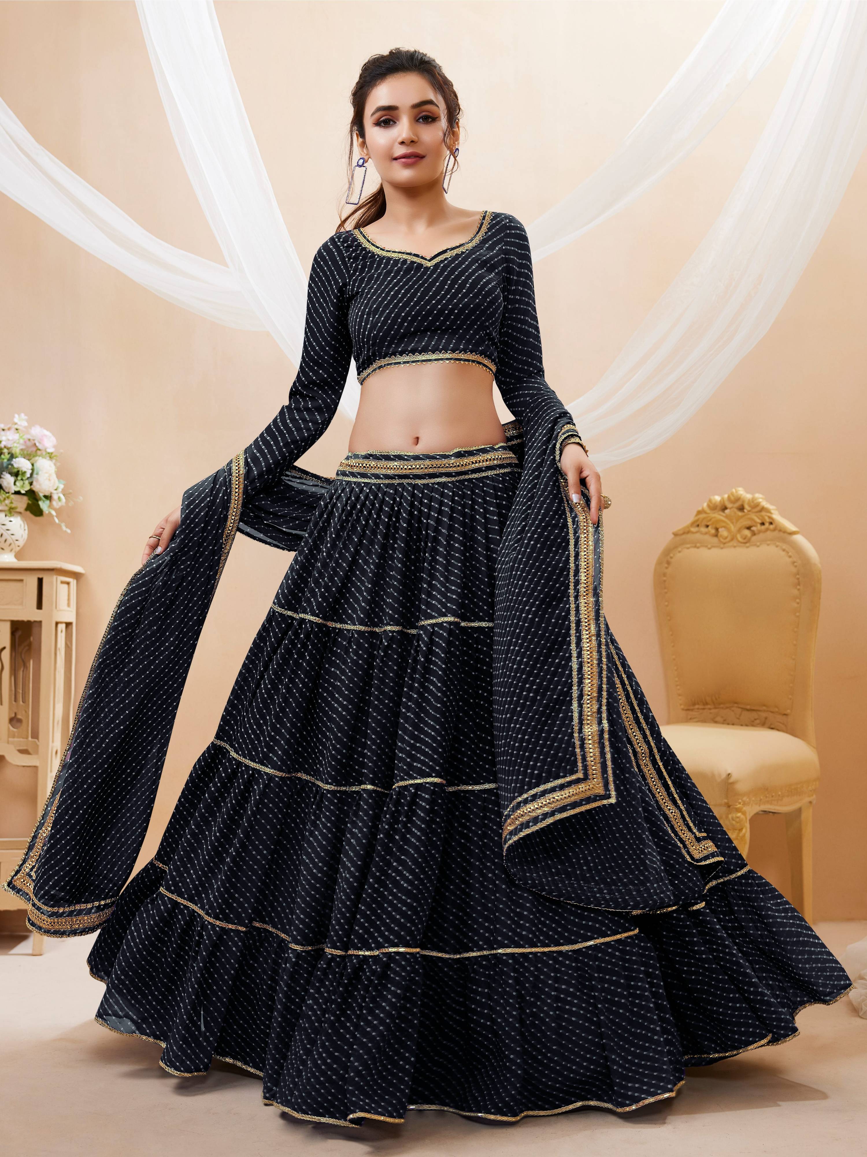 Black georgette lehenga choli featuring leheriya print and lace work