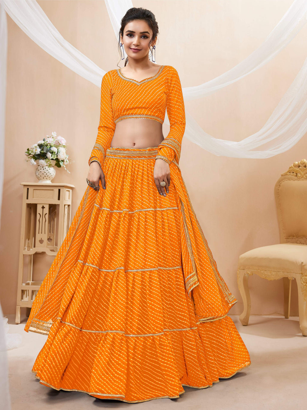 Yellow georgette leheriya printed lehenga choli with lace trim