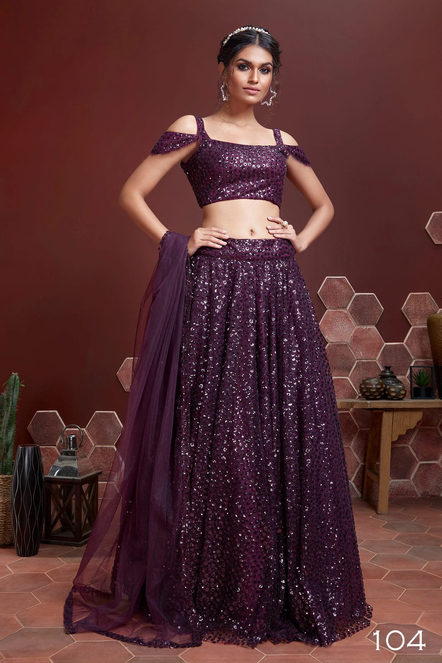 Purple soft net lehenga choli with heavy sequins embroidery and cancan flare.