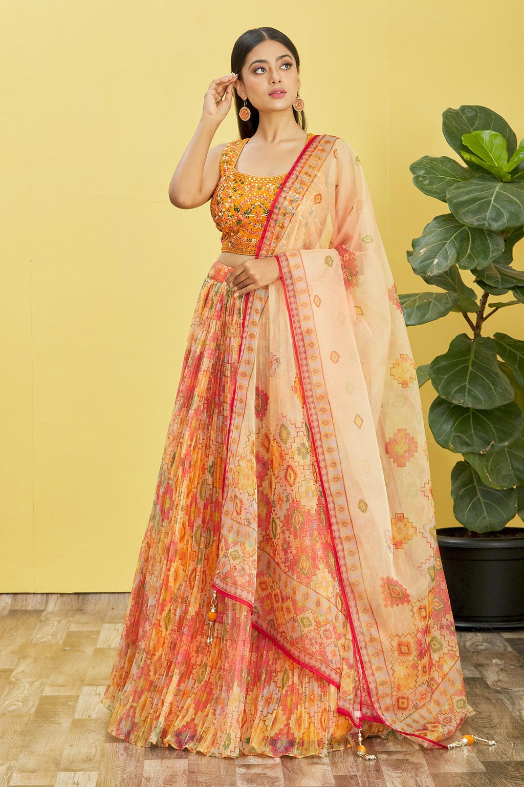 Yellow organza lehenga choli with real mirror work and sequin embroidery
