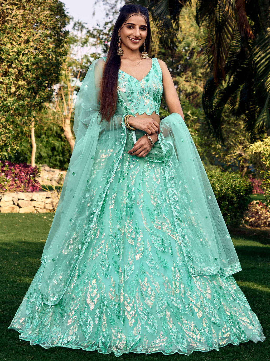 Blue soft net lehenga choli set with decorative sequins and thread work embroidery