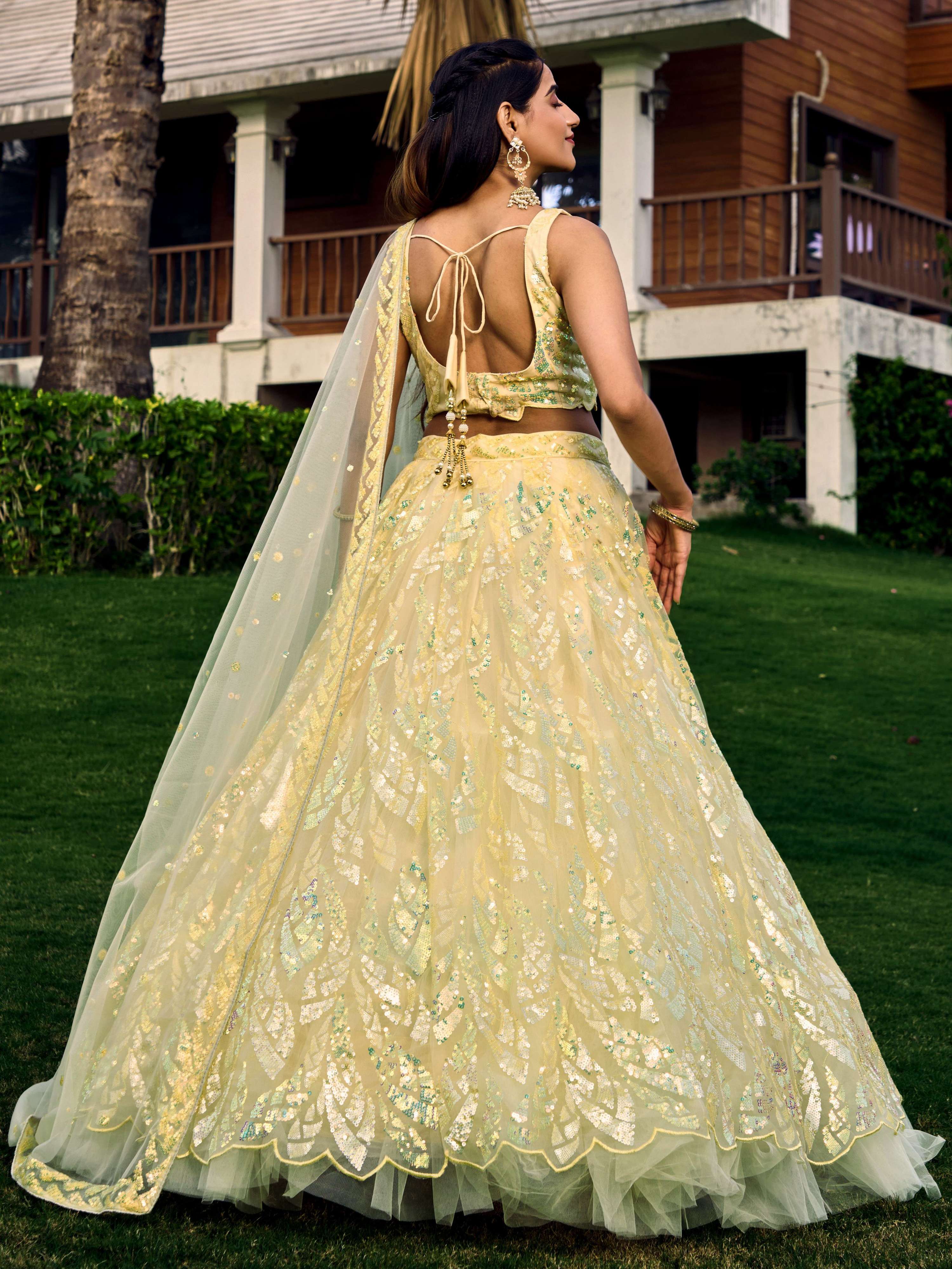Yellow Soft Net Lehenga Choli with Multi-Sequins Thread Embroidery