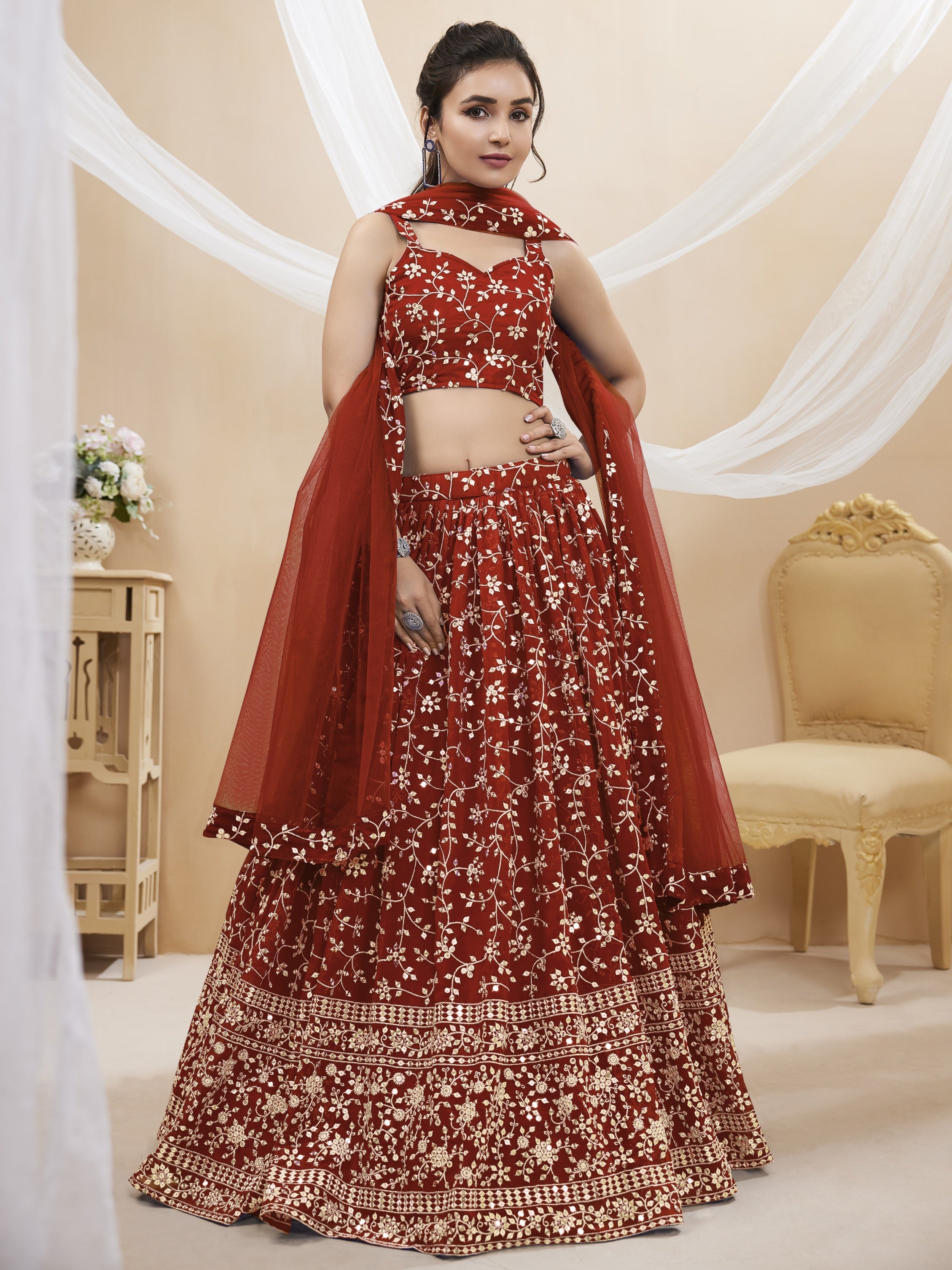 Maroon georgette lehenga choli with detailed zari and sequin embroidery