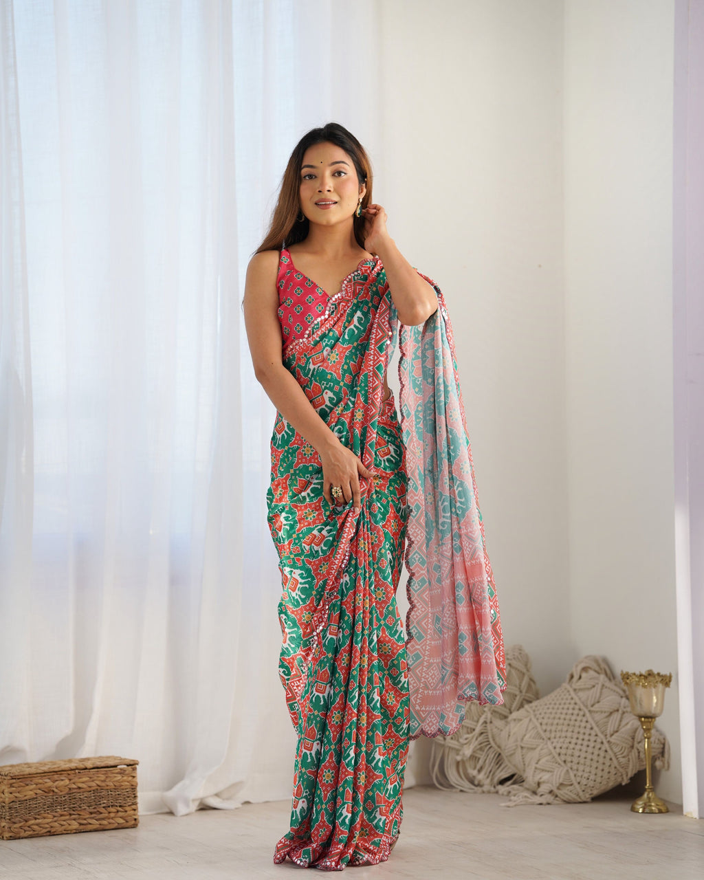 Green Chinon fabric designer saree with printed patterns and detailed mirror work