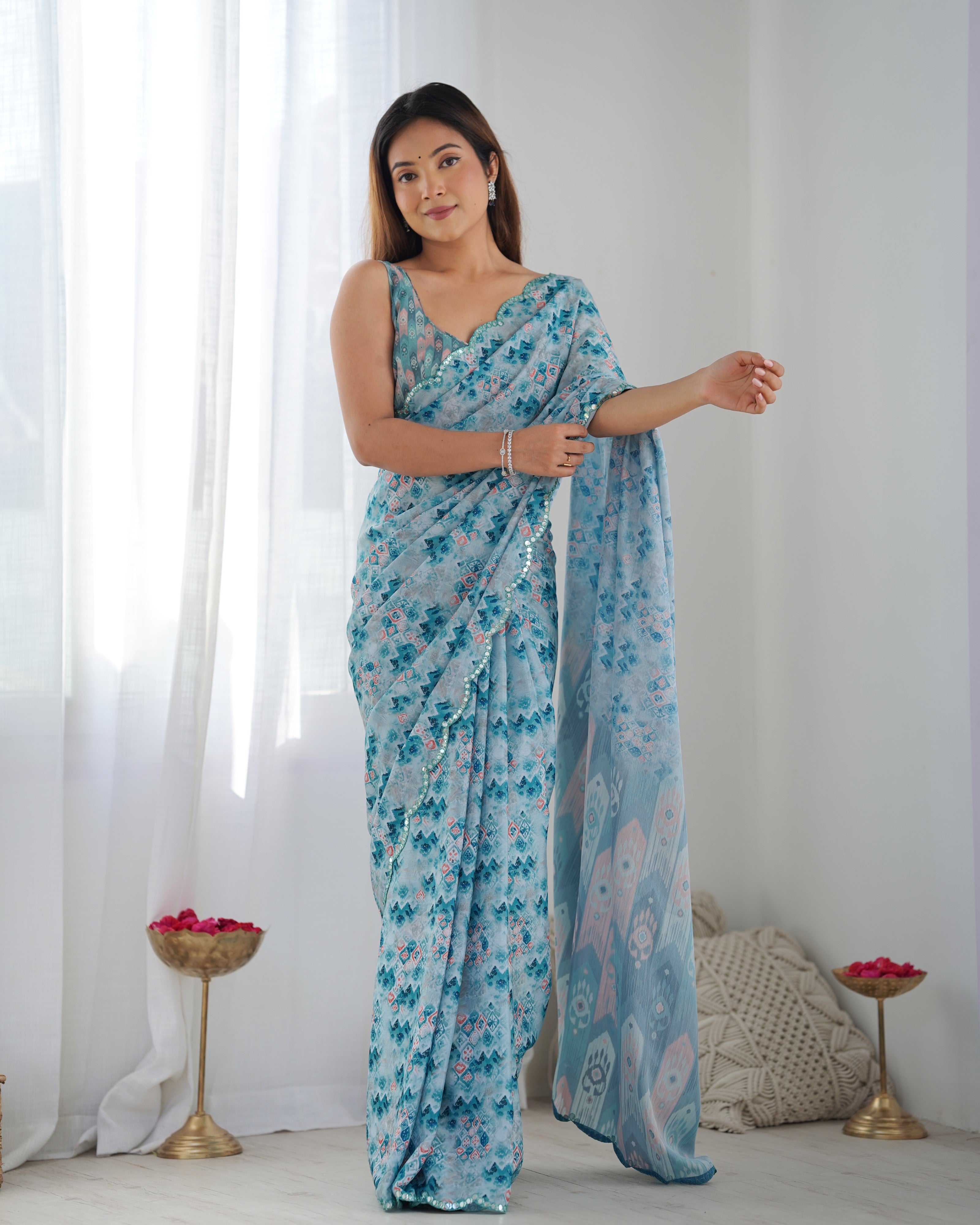 Sky blue Chinon printed saree with mirror work and matching blouse piece