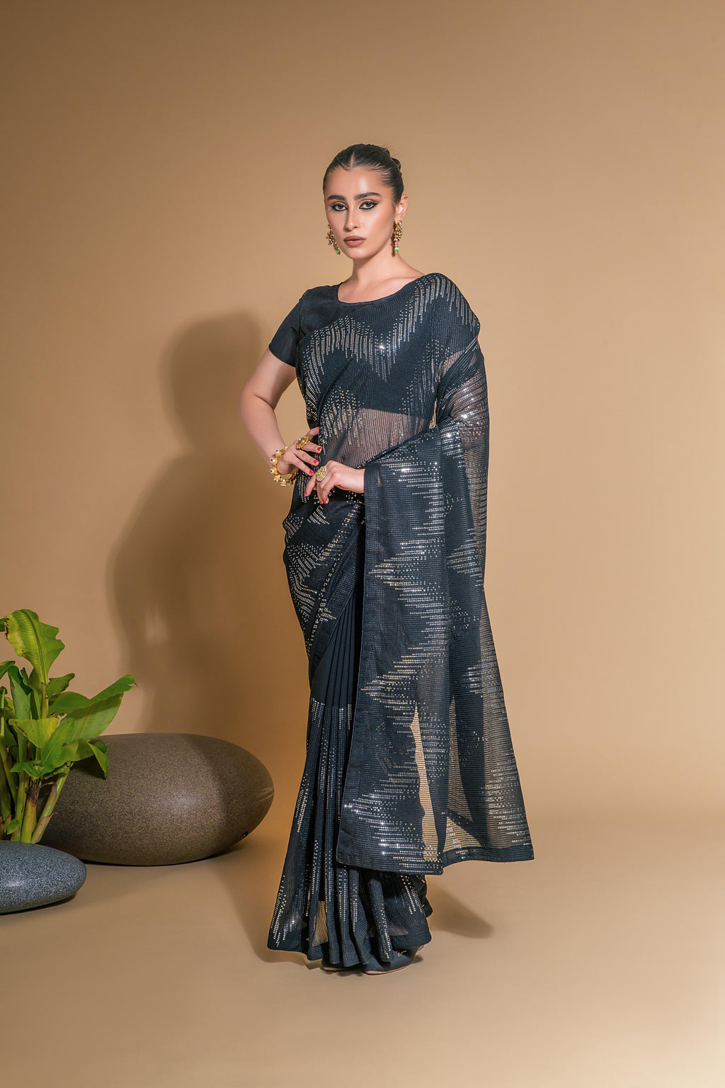 Sophisticated black georgette saree with sequins work and Banglory Silk blouse fabric