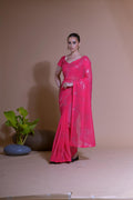 Pink georgette party wear saree with sequins embroidery and blouse piece