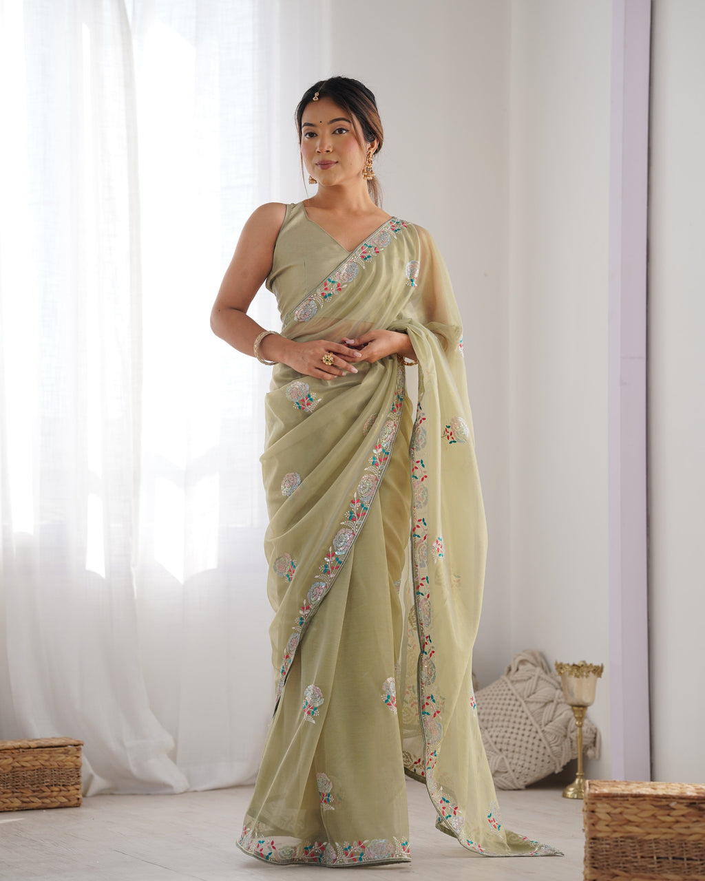 Pista Green net saree with sequins embroidery and silk blouse piece