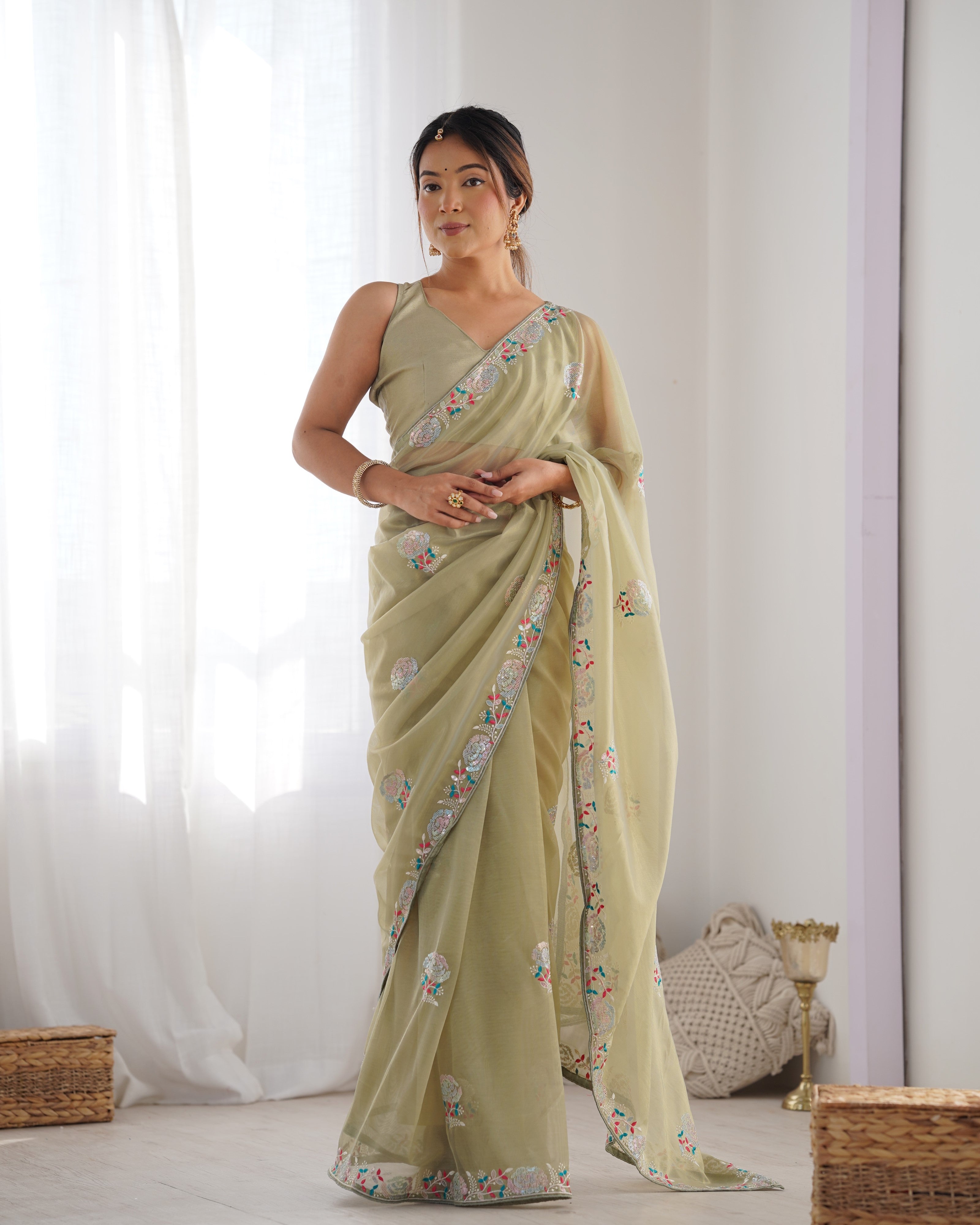 Pista Green net saree with sequins embroidery and silk blouse piece