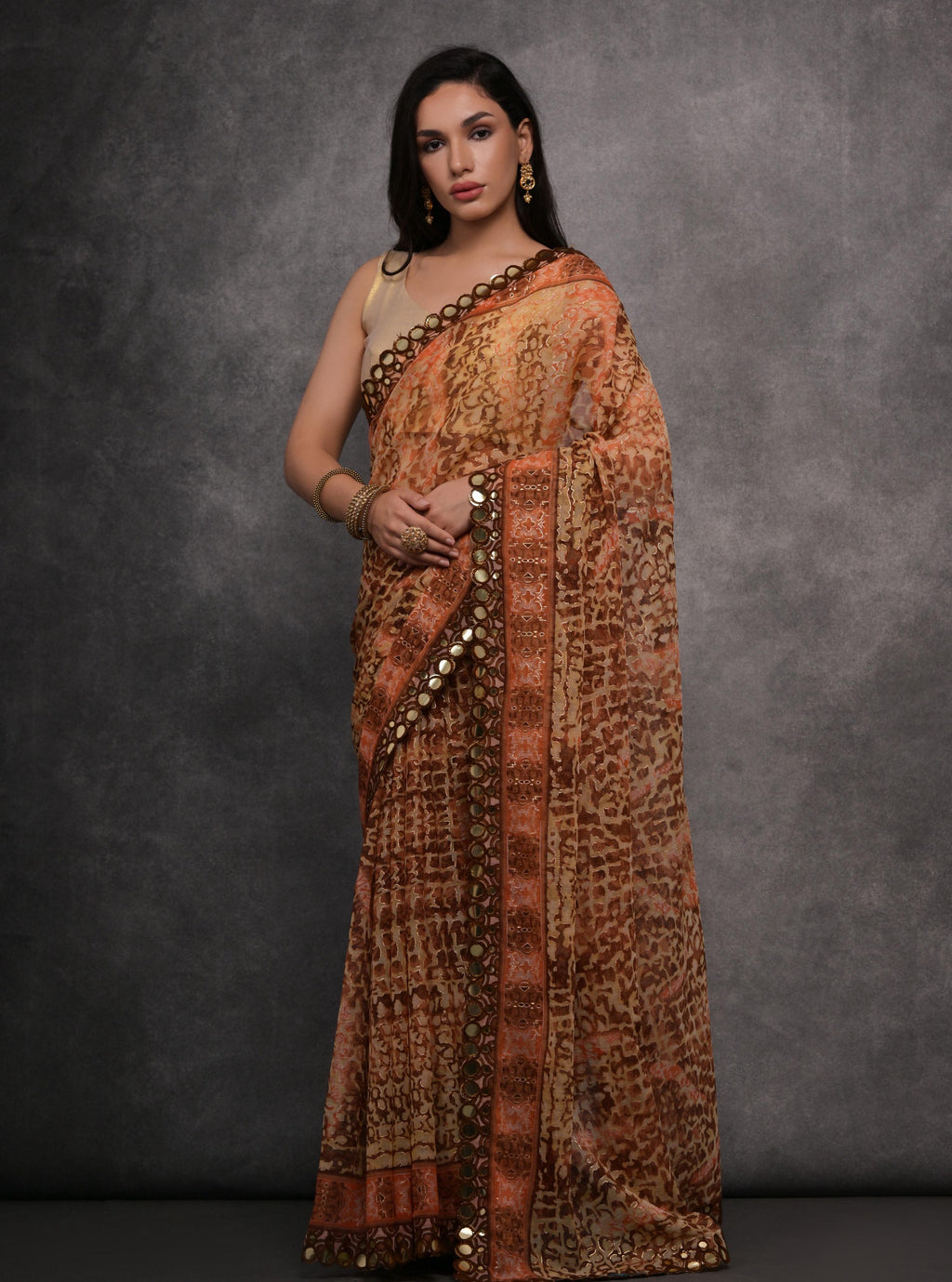 Brown chiffon designer saree with intricate mirror work and matching unstitched blouse
