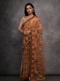 Brown chiffon designer saree with intricate mirror work and matching unstitched blouse