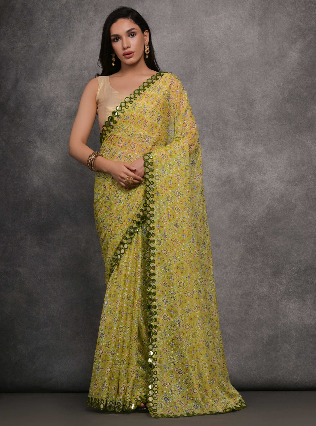 Mehendi colored Chiffon saree with elegant mirror work and unstitched blouse