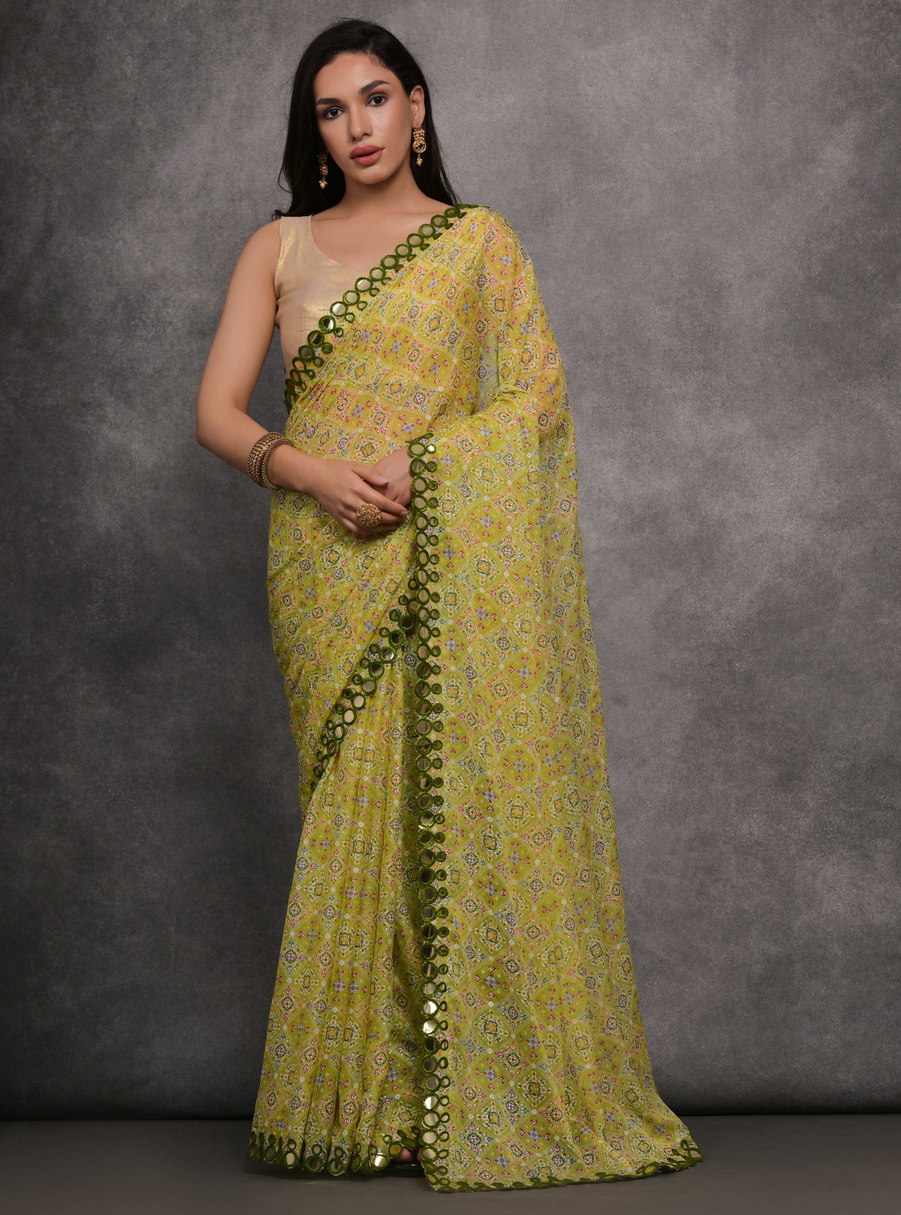 Mehendi colored Chiffon saree with elegant mirror work and unstitched blouse