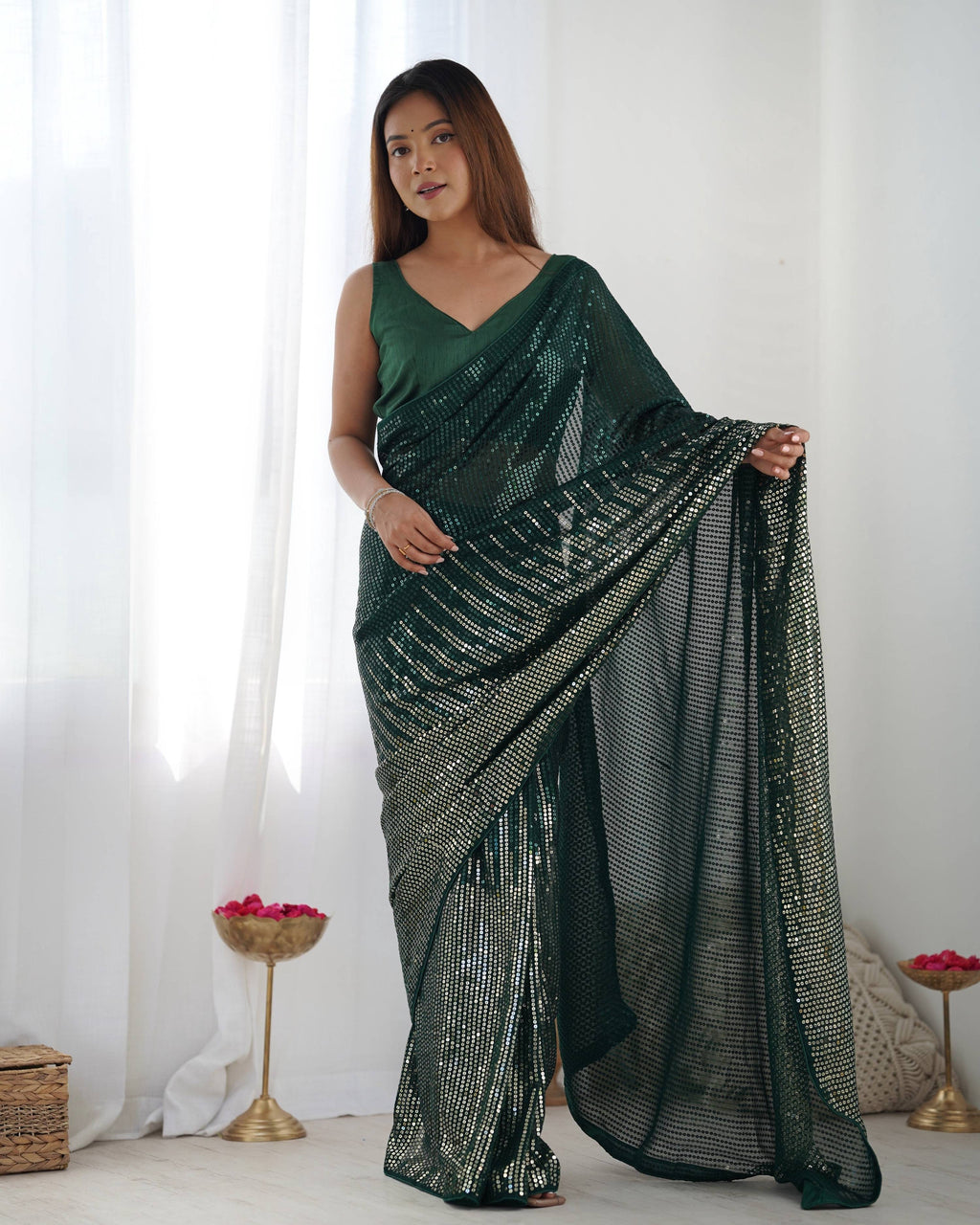 Bottle Green Georgette designer saree adorned with sequins work and Banglory Silk blouse piece.