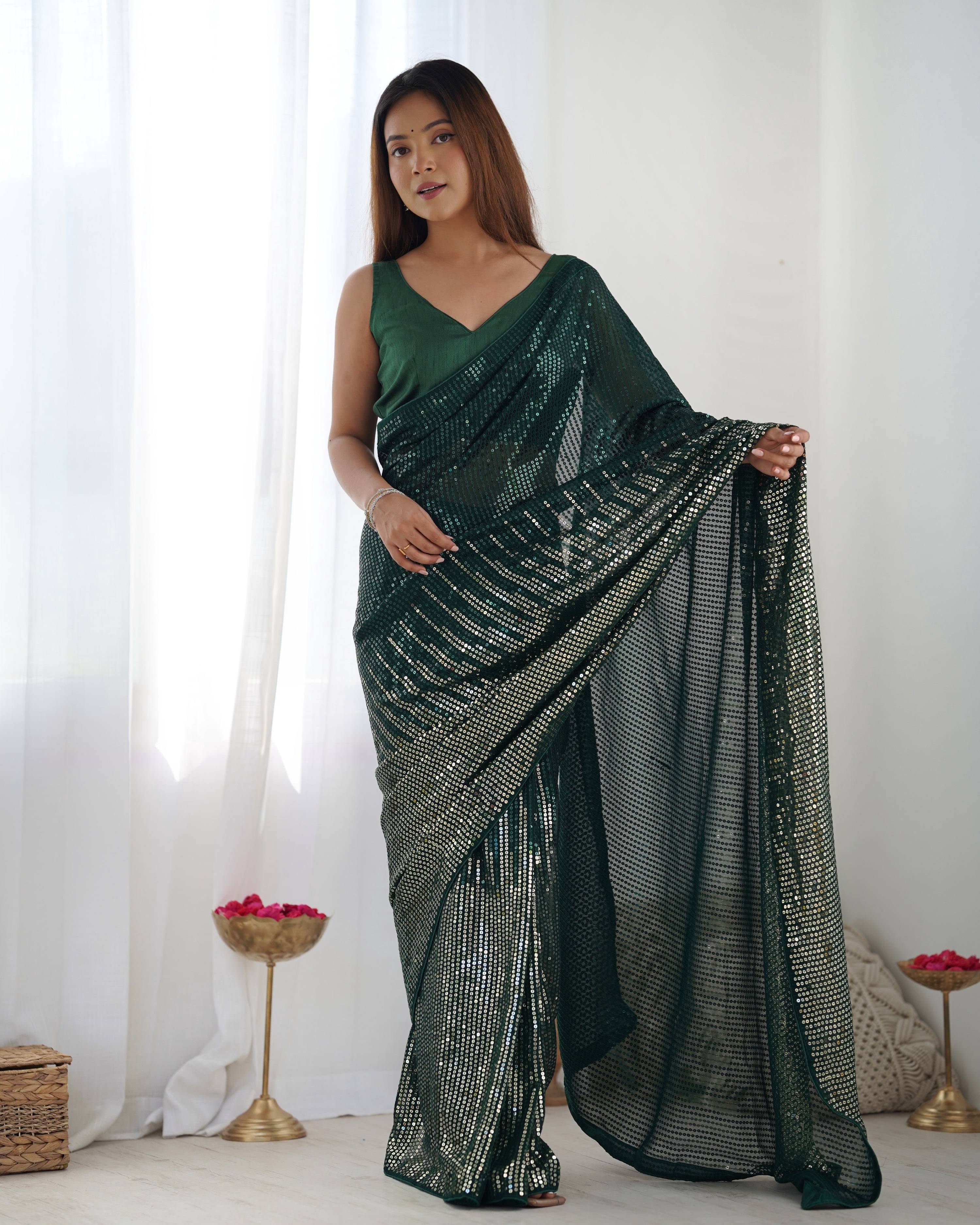 Bottle Green Georgette designer saree adorned with sequins work and Banglory Silk blouse piece.