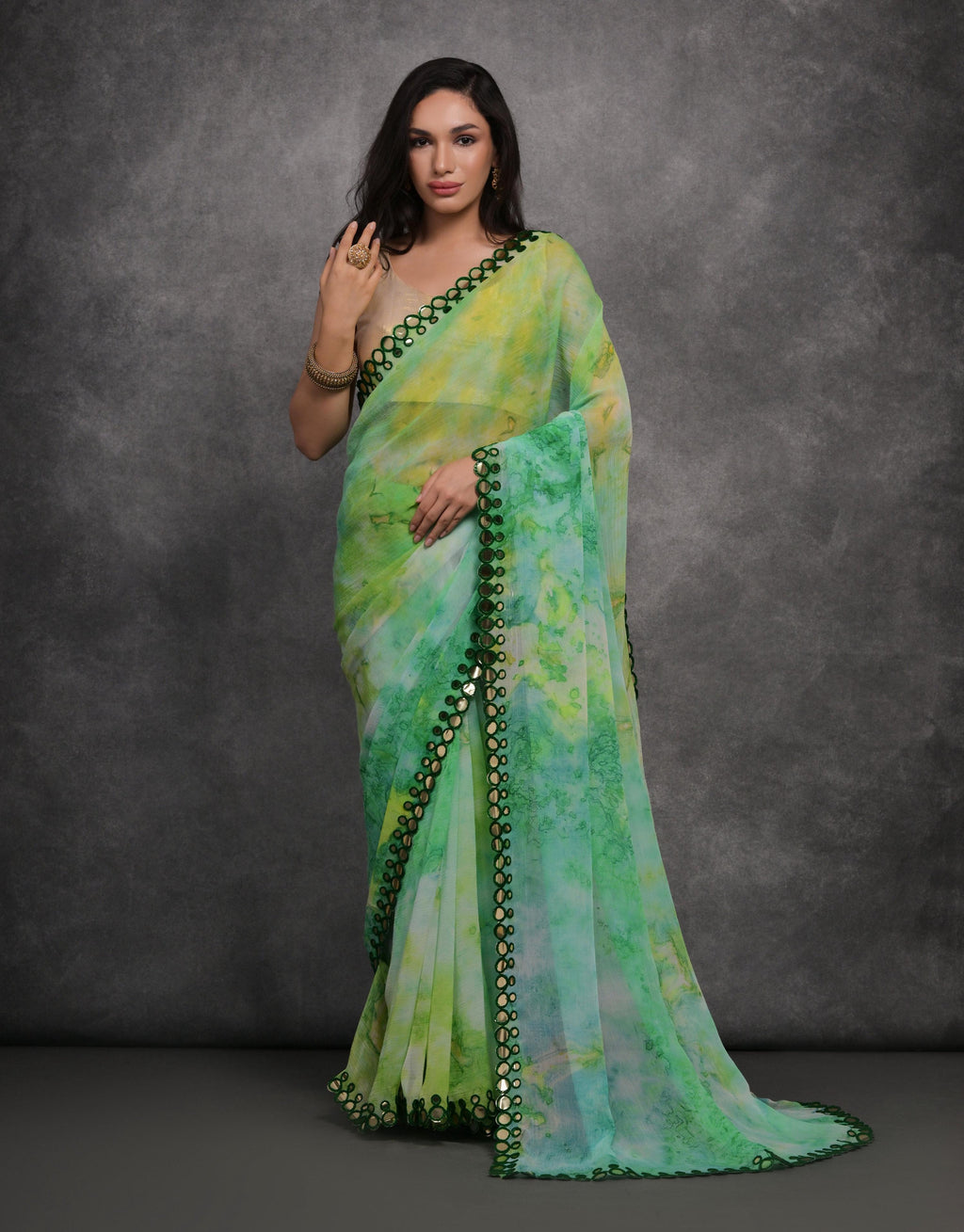 Green chiffon printed saree with mirror work detailing