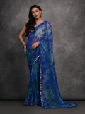 Blue printed chiffon saree with mirror work accents and matching blouse piece