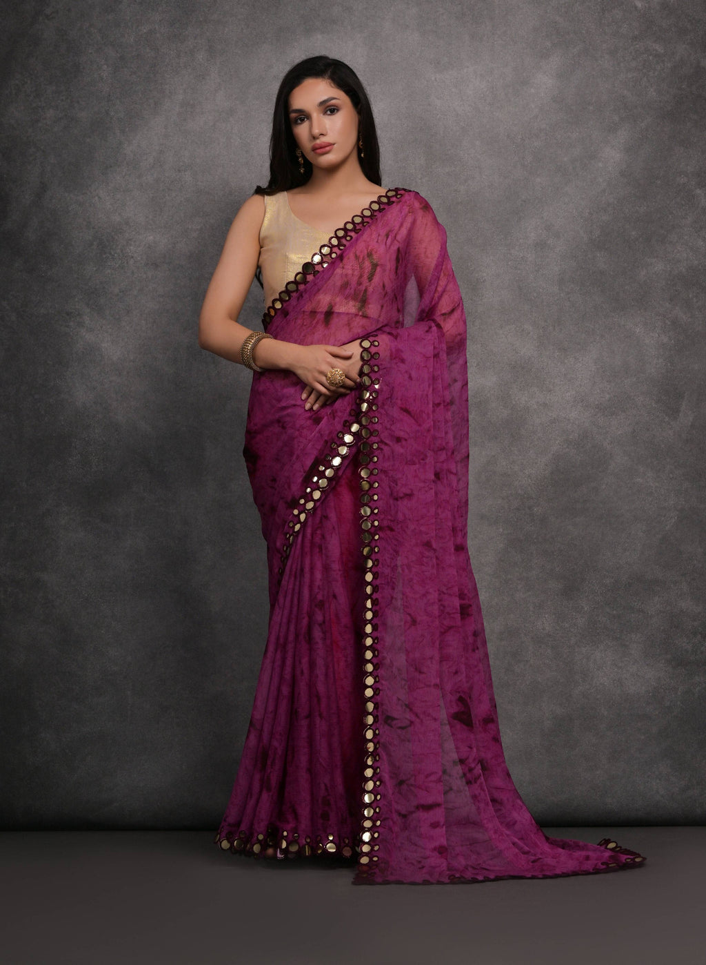 Wine Chiffon saree with intricate prints and mirror work detailing, paired with a matching blouse.