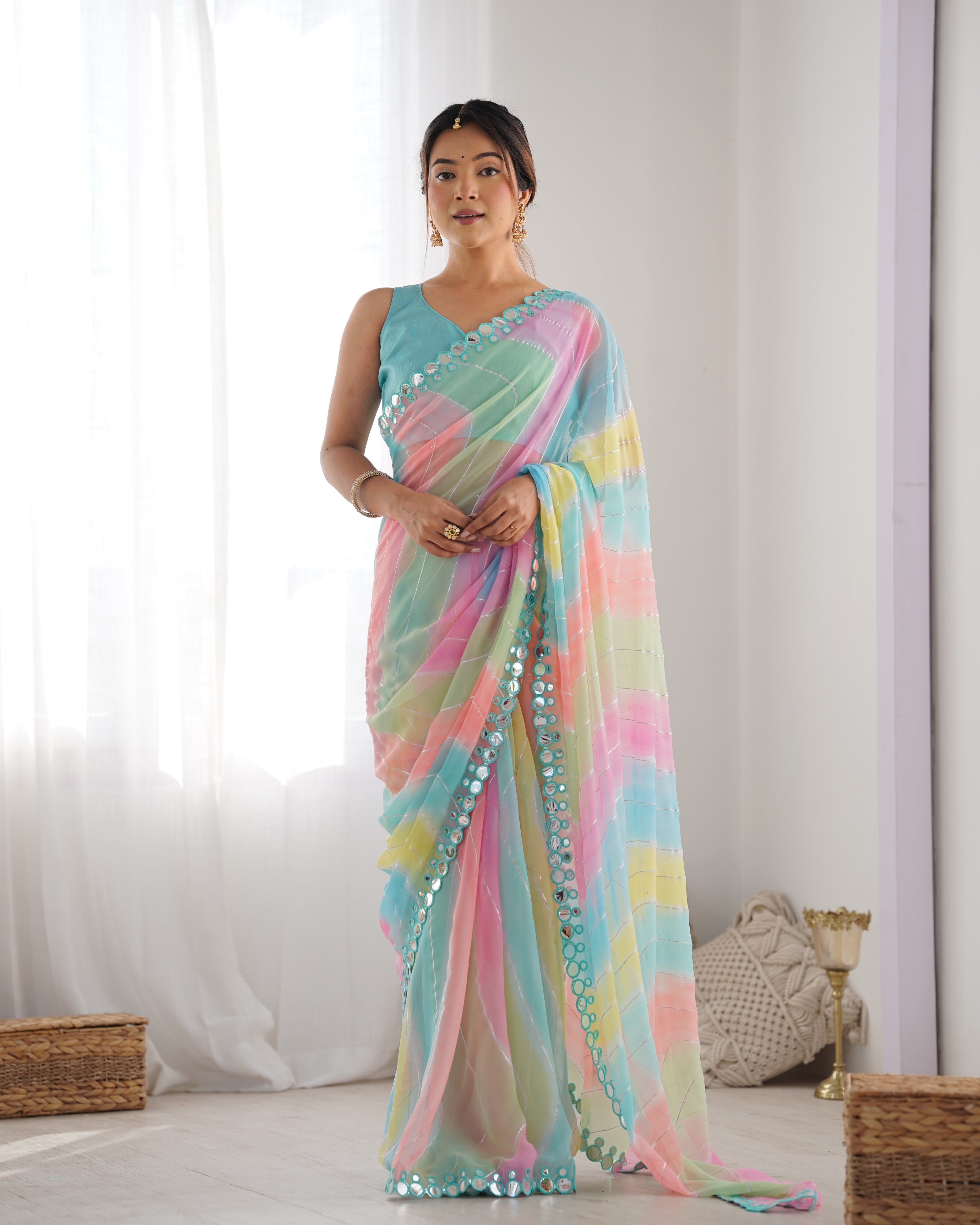 Multicolor Georgette saree featuring intricate mirror work and designer print