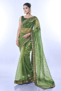 Vibrant green net designer saree with detailed sequins embroidery and matching blouse piece