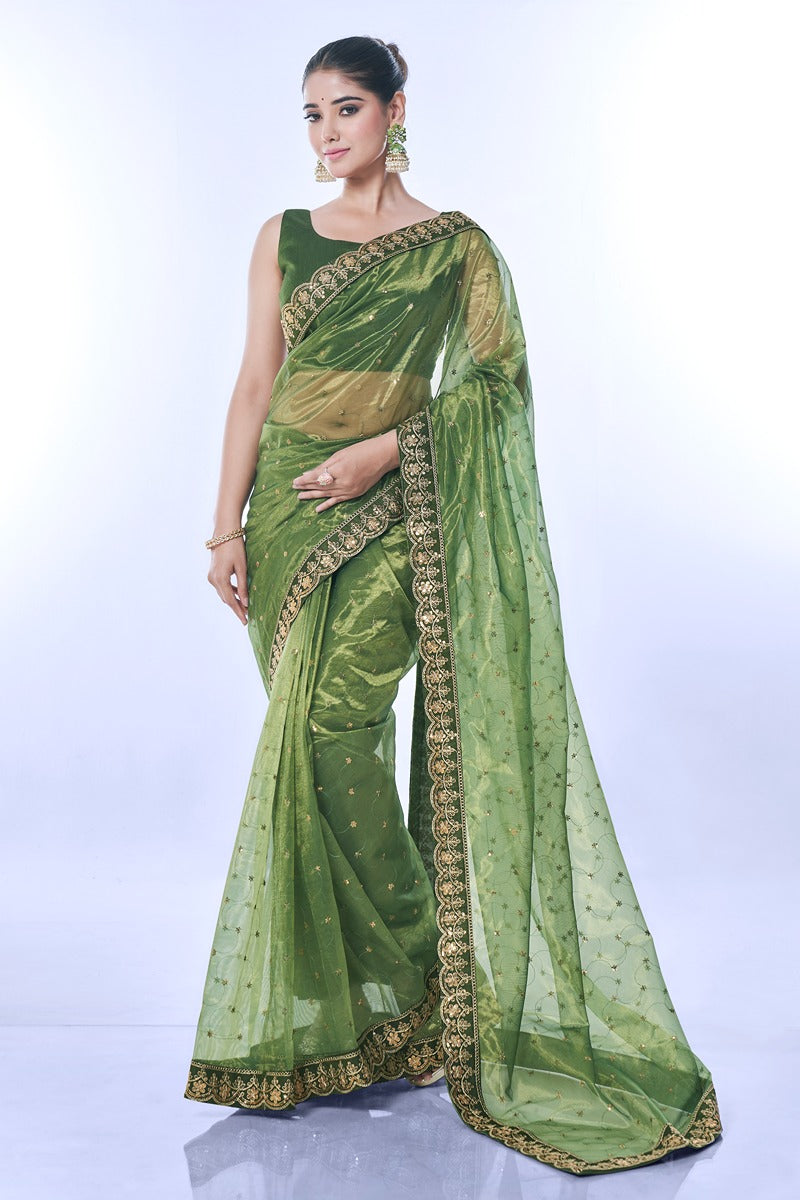 Vibrant green net designer saree with detailed sequins embroidery and matching blouse piece
