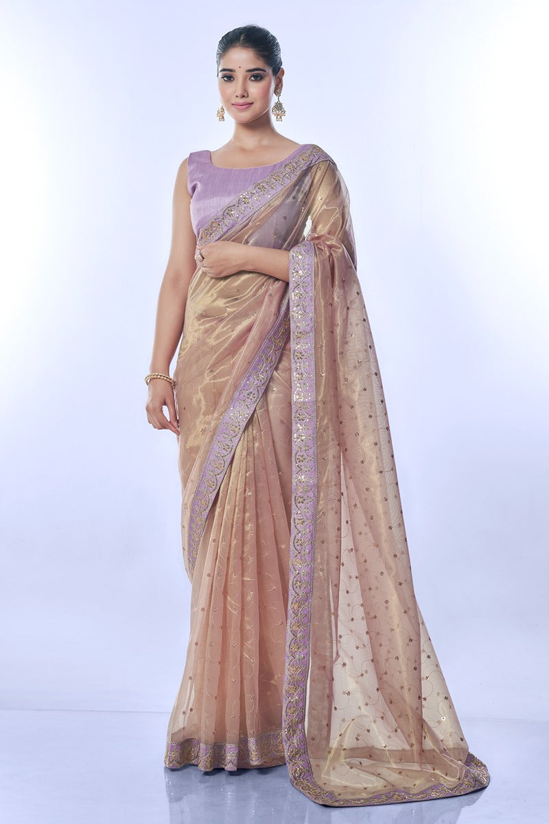 Elegant purple net saree with intricate sequins embroidery and matching unstitched blouse piece