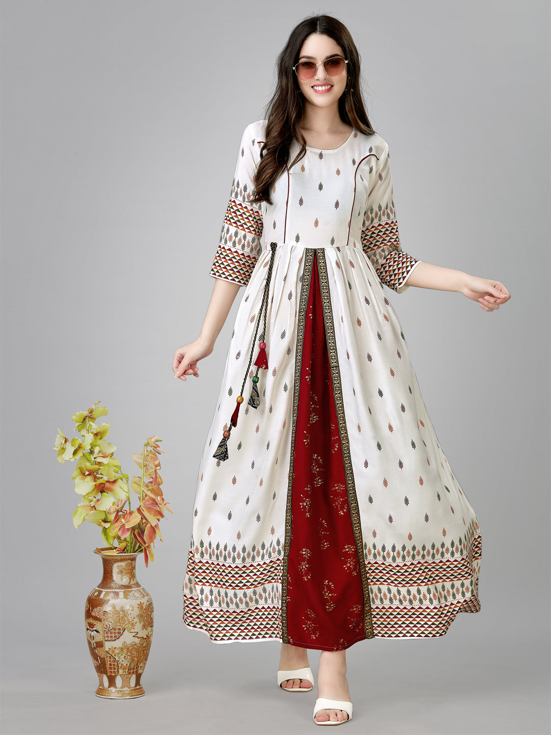 Long white A-line dress with subtle leaf pattern prints
