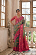Rama colored Banarasi silk saree with gold Zari woven floral pattern and matching blouse