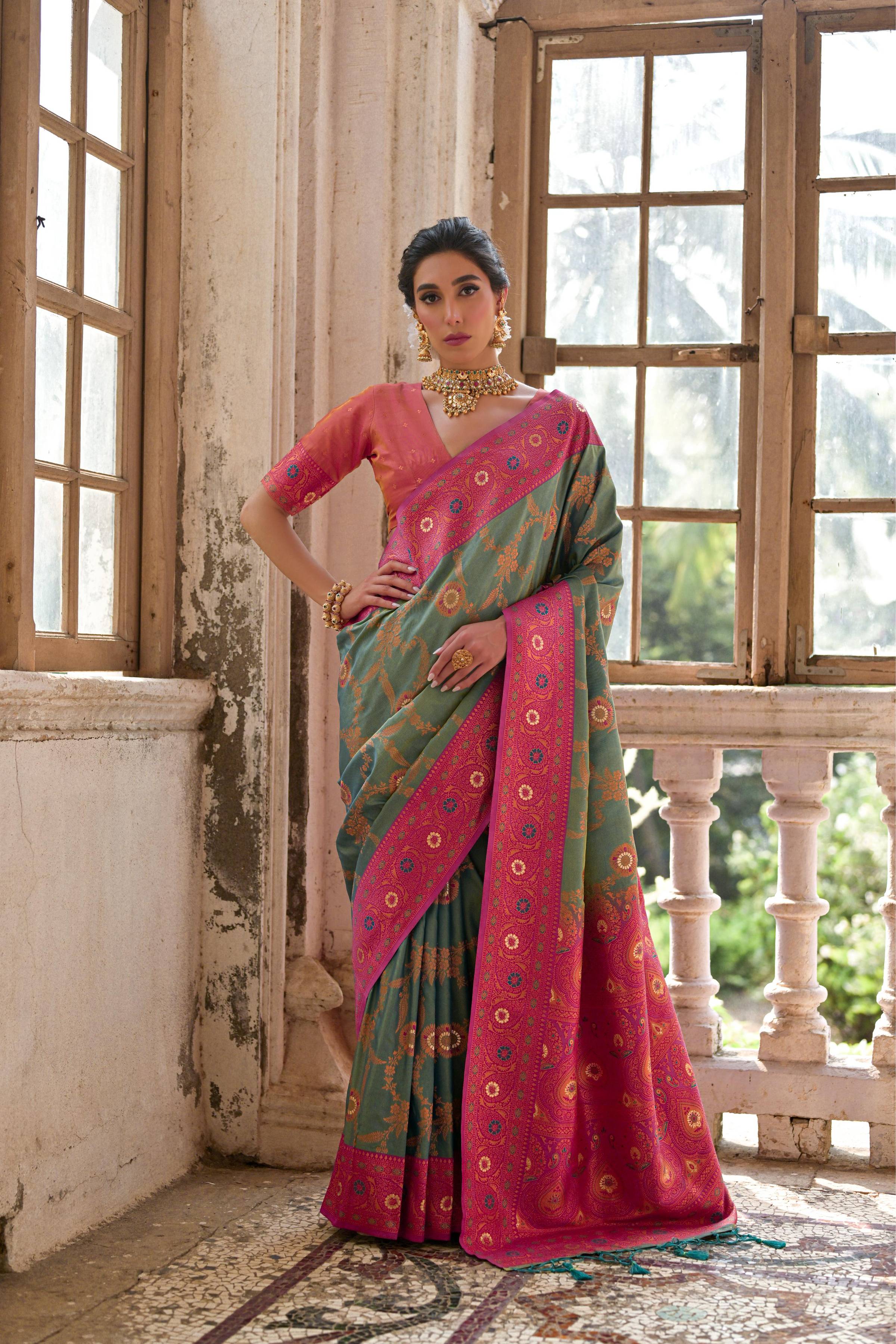 Rama colored Banarasi silk saree with gold Zari woven floral pattern and matching blouse