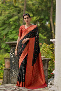 Black Banarasi silk saree with intricate gold Zari woven border and matching blouse piece.
