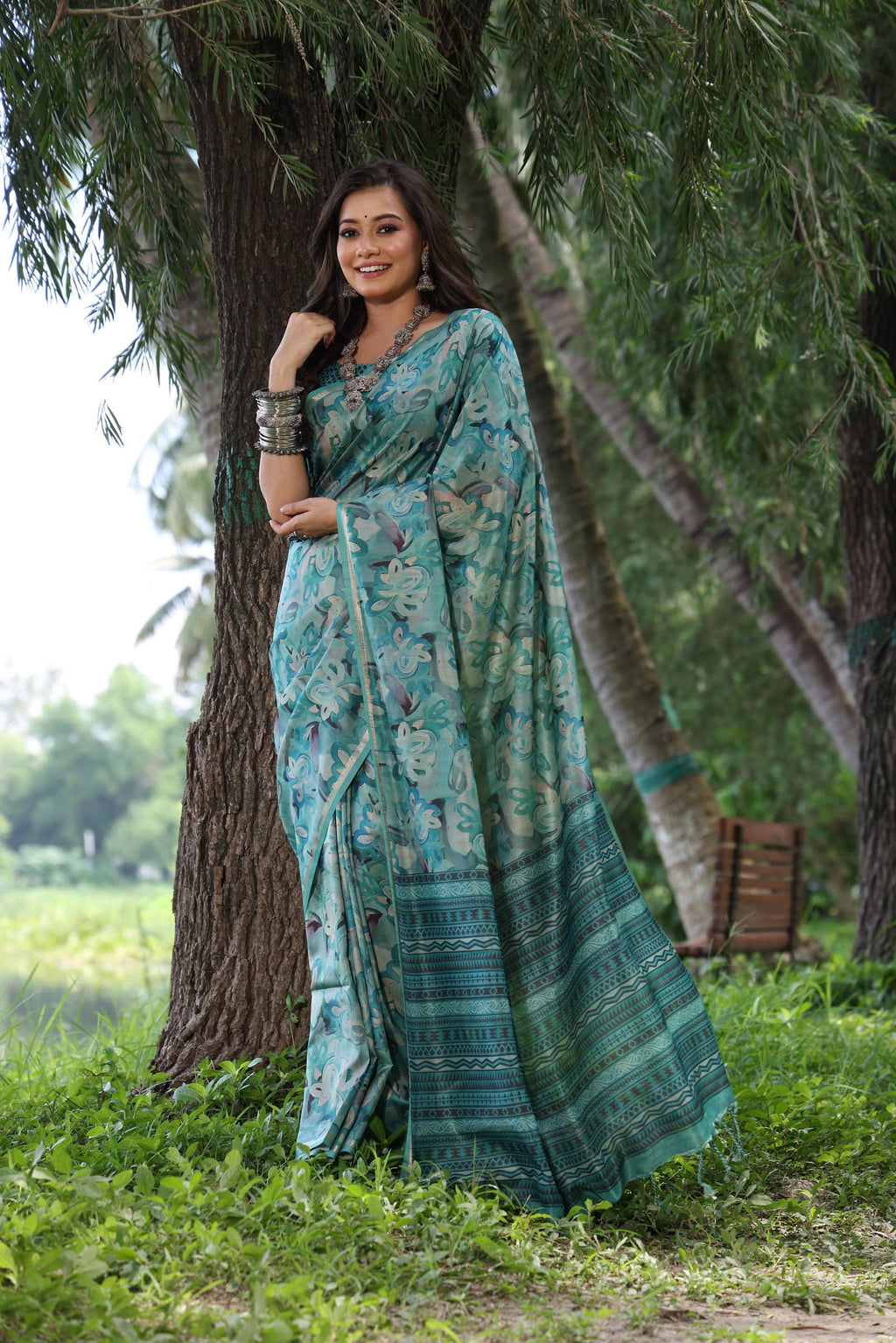 Sky blue soft Tussar silk saree with printed patterns and zari woven border with matching blouse piece