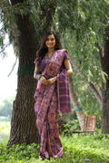 Purple Tussar silk saree with intricate printed design and gold Zari weaving