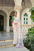 A graceful Wine Muga Cotton saree with intricate floral weaving and a matching blouse.
