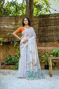 Orange soft Muga cotton saree featuring intricate floral weaving and a matching blouse.