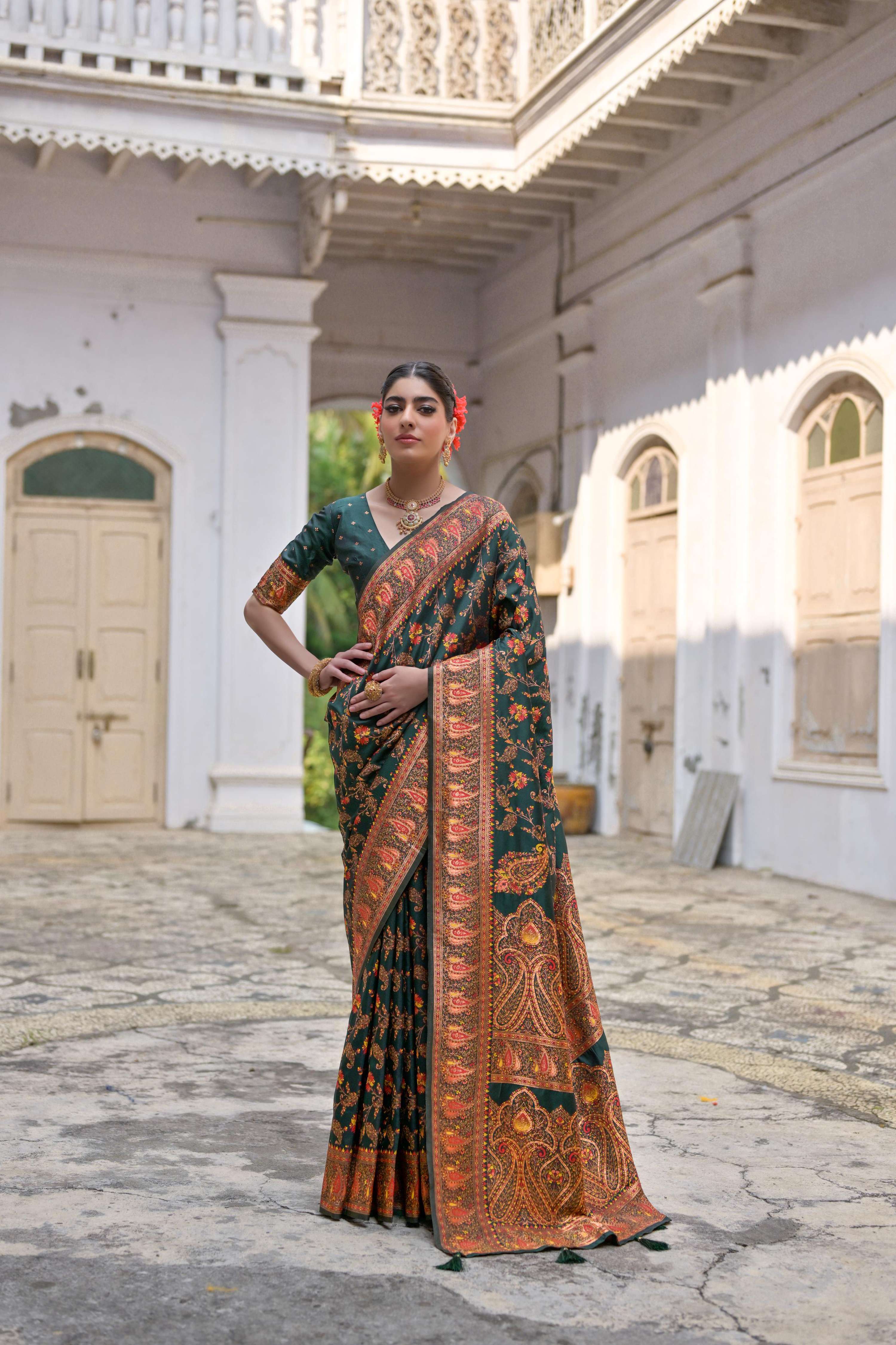 Bottle Green Pashmina silk saree with detailed Meena Zari woven border and included matching blouse.
