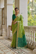 Green soft raw silk saree with intricate gold zari woven details