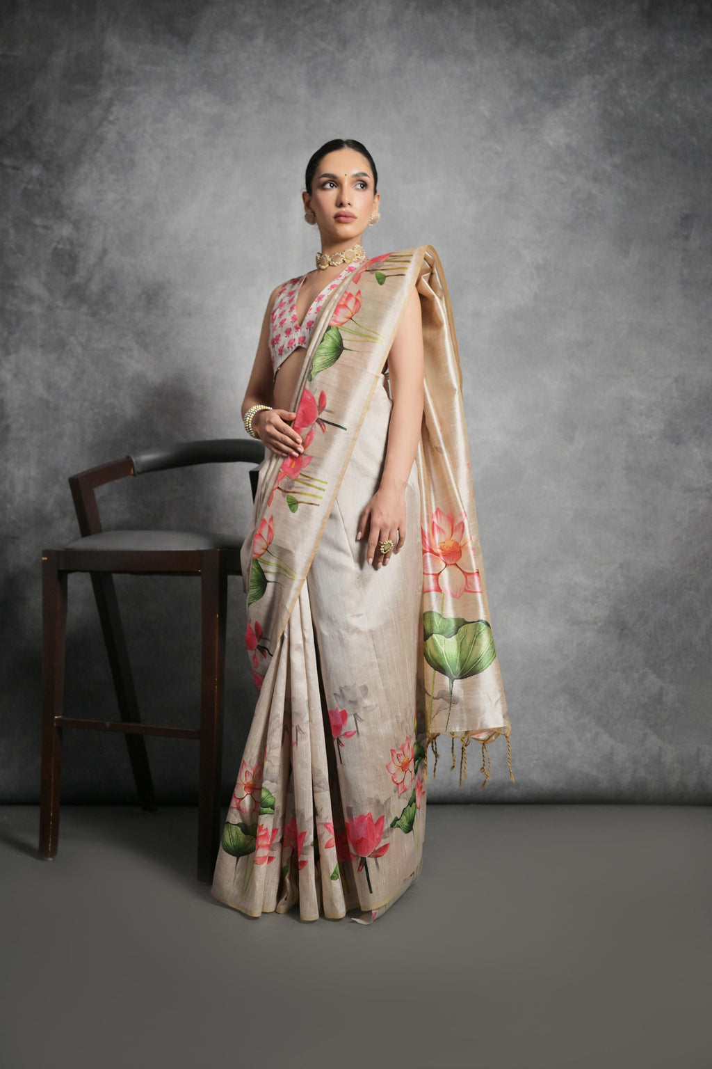 Elegant beige soft tussar silk saree with delicate floral print patterns
