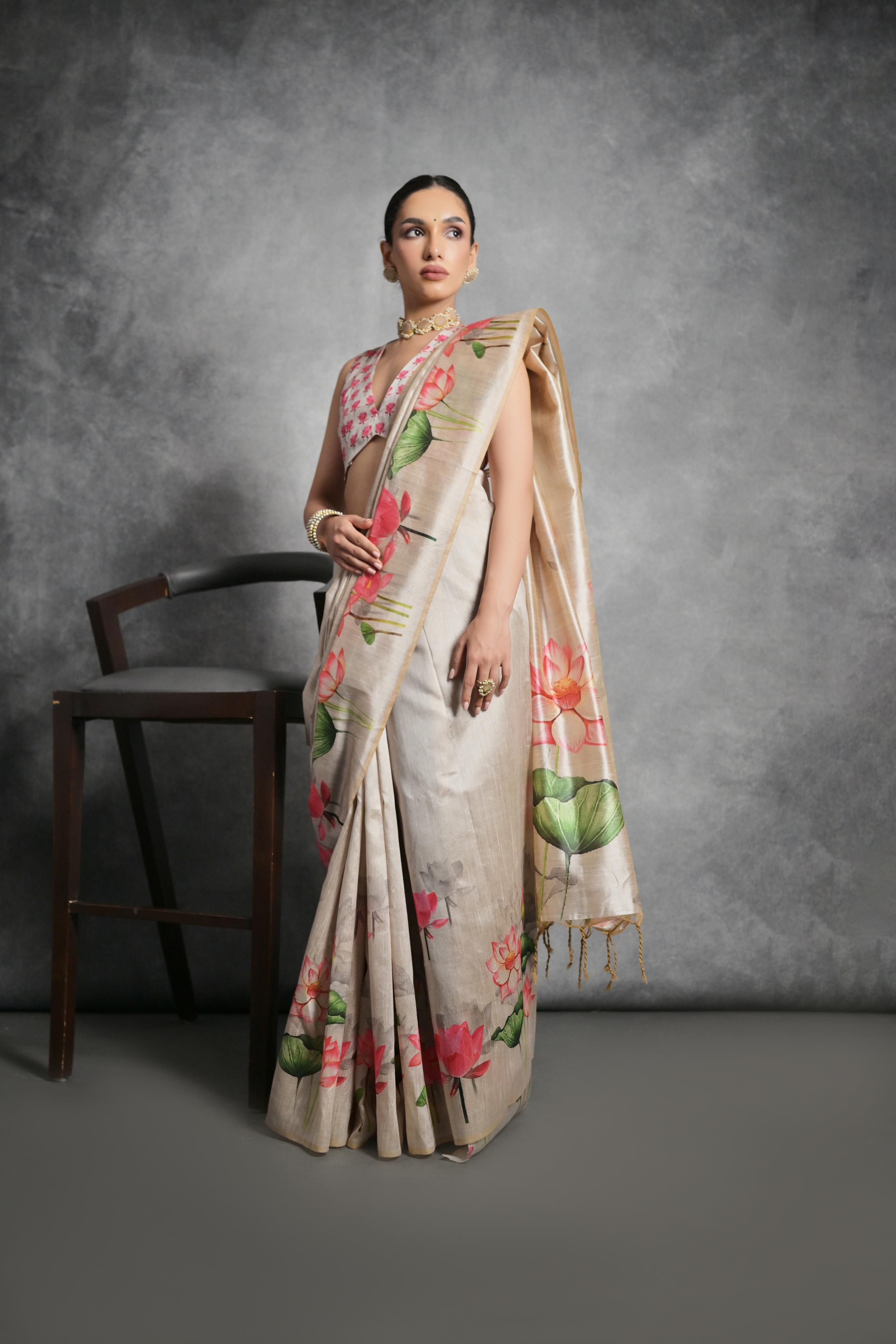 Elegant beige soft tussar silk saree with delicate floral print patterns