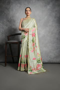 Pista Green soft Tussar silk saree with delicate floral prints and matching blouse.