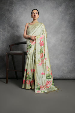 Pista Green soft Tussar silk saree with delicate floral prints and matching blouse.