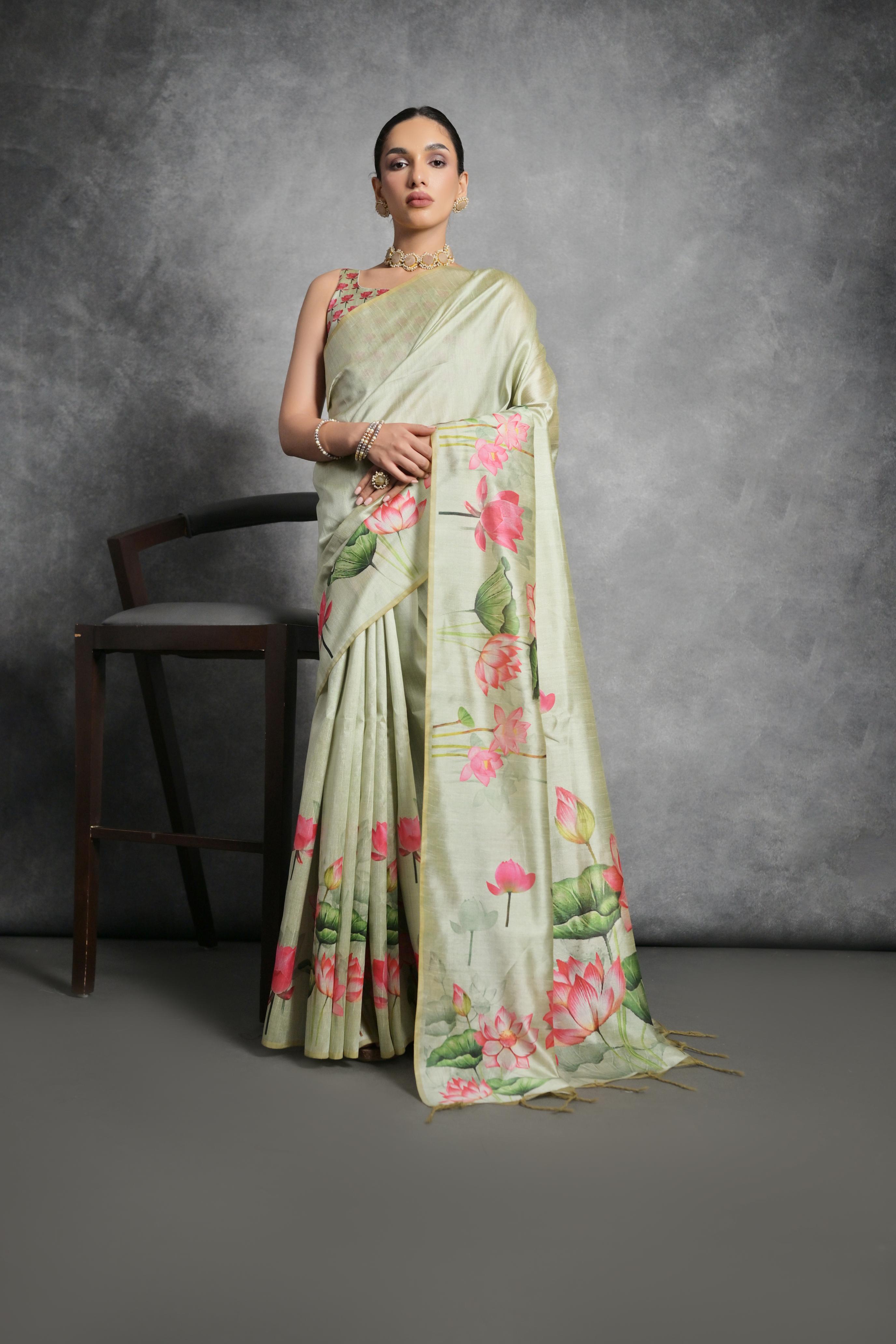 Pista Green soft Tussar silk saree with delicate floral prints and matching blouse.