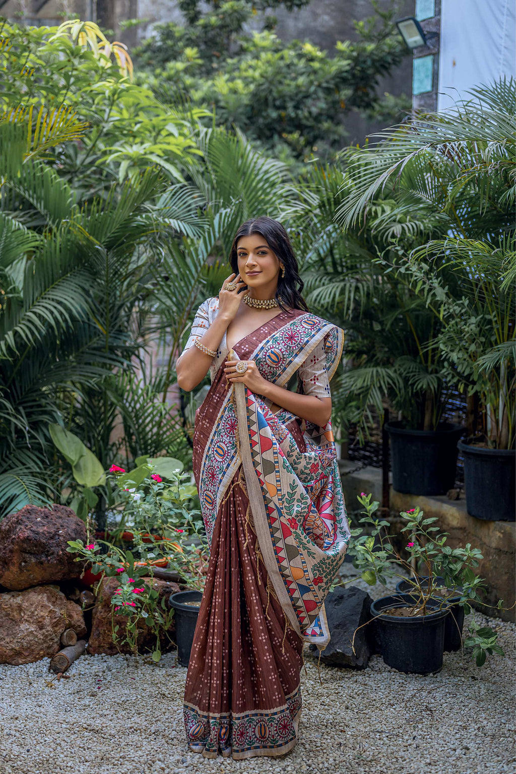 Brown soft Tussar silk saree featuring traditional Madhubani printed patterns and included blouse.