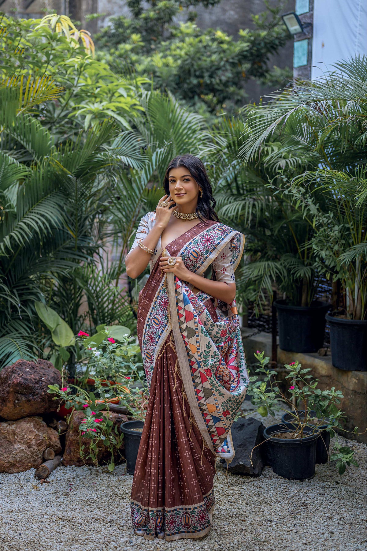 Brown soft Tussar silk saree featuring traditional Madhubani printed patterns and included blouse.
