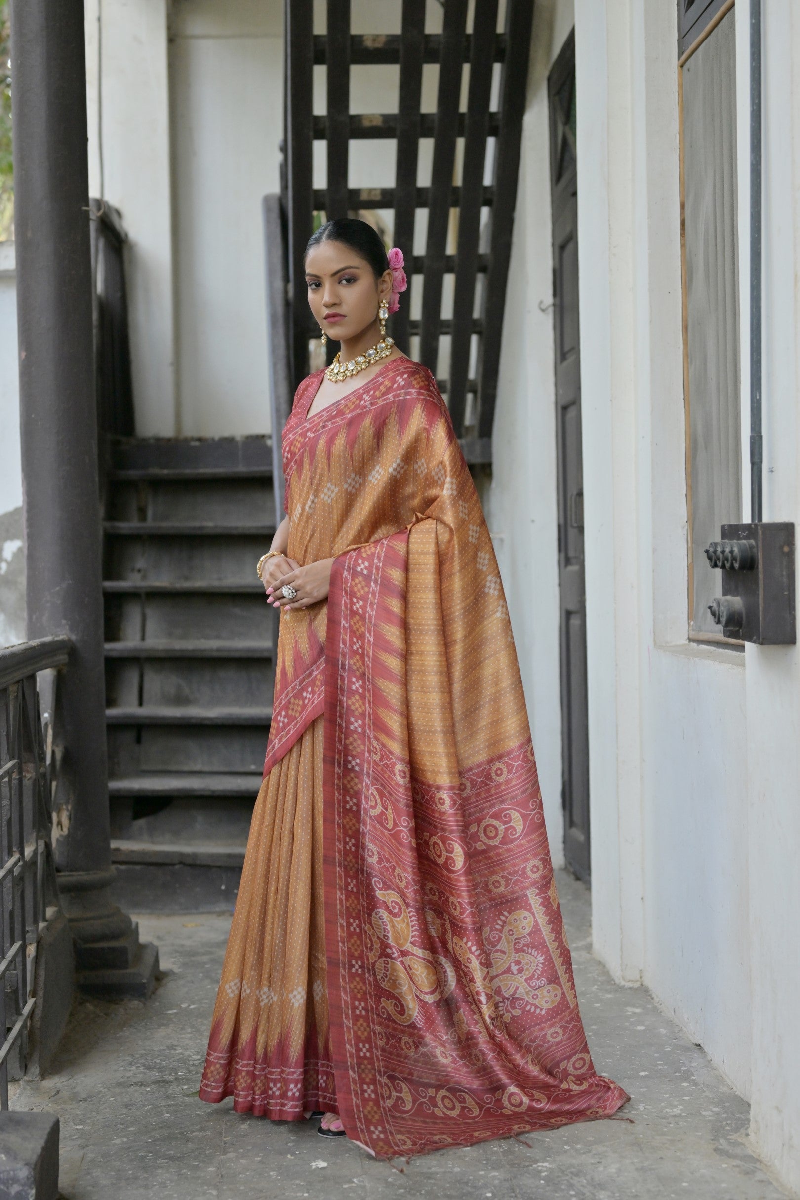 Mustard soft tussar silk saree with a traditional temple border and included blouse.