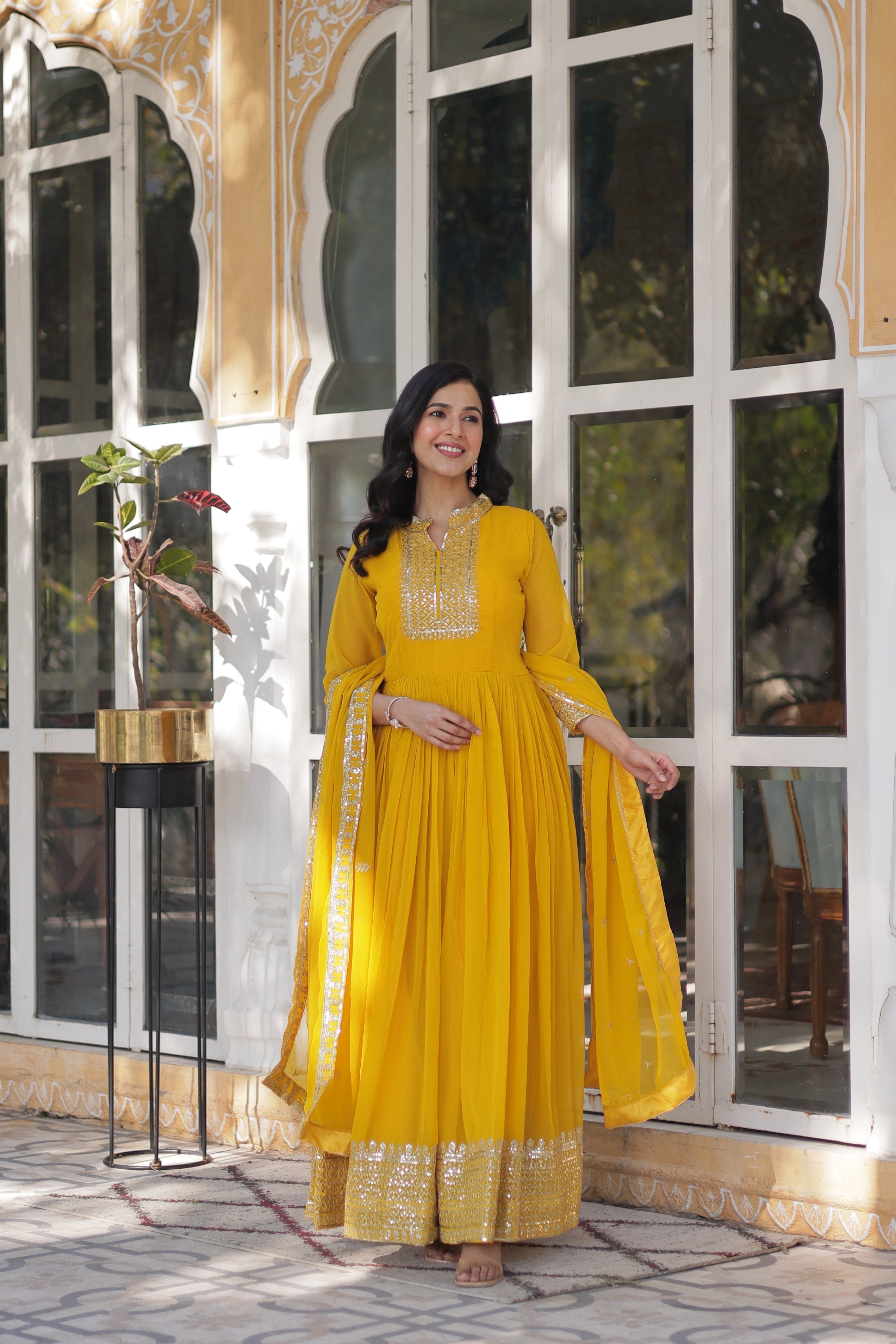 Yellow faux georgette Anarkali suit with heavy sequins embroidery and matching dupatta