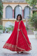 Woman wearing a Red Faux Blooming Anarkali set with multi-sequin embroidery and matching dupatta