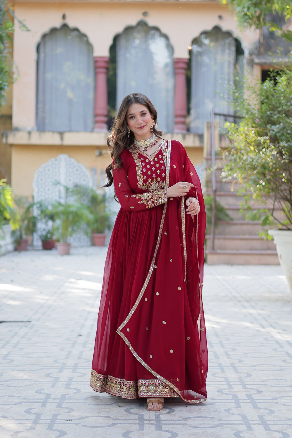 Maroon Faux Georgette Anarkali set with sequin embroidery detail.